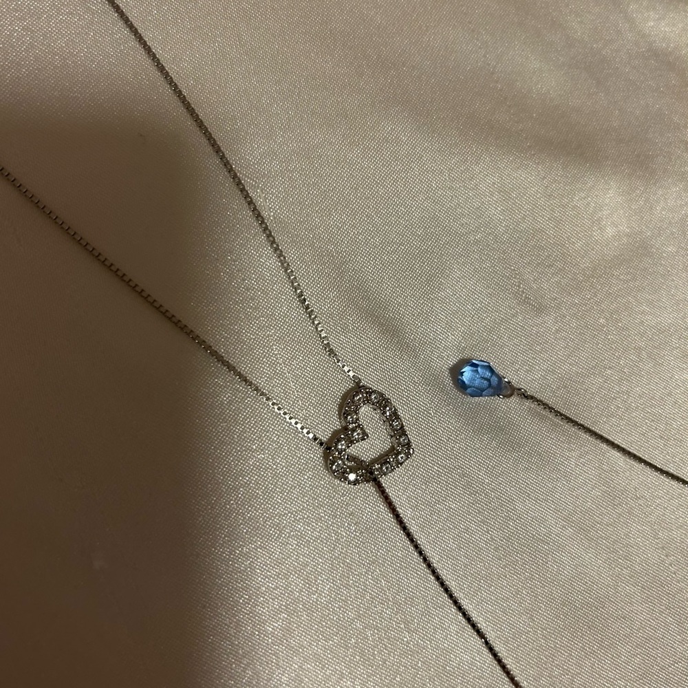 Tear drop necklacece, pave diamond heart with light blue stone at tail